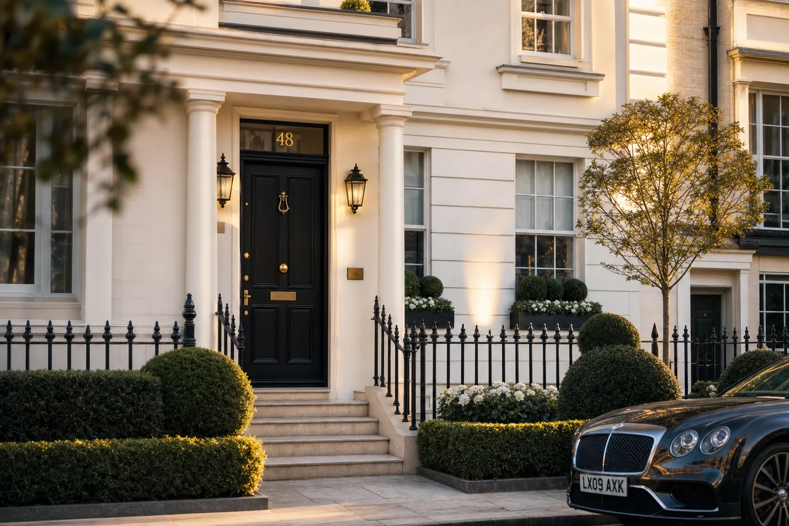 Elegant Georgian townhouse with black door and wrought iron railings in Belgravia, London